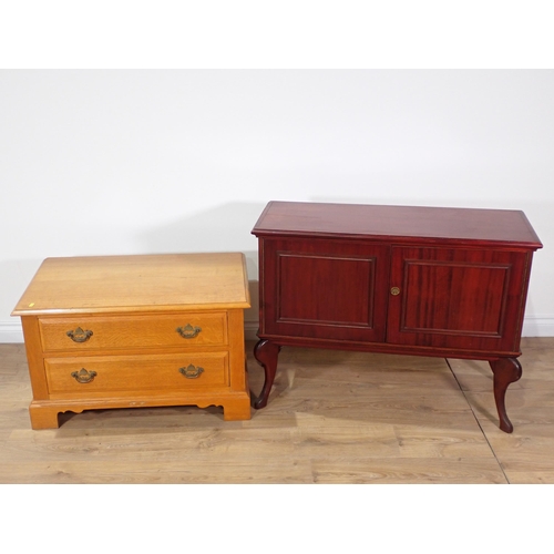 568 - An oak TV Stand and a mahogany veneered Cupboard