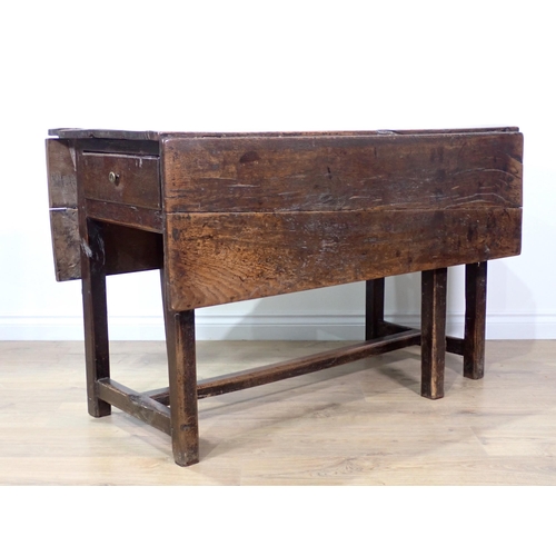 584 - An 18th Century and later dropleaf Table fitted drawer to each end mounted upon square cut chamfered... 