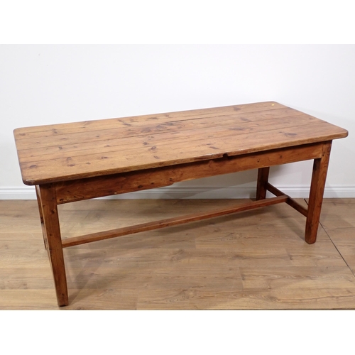 590 - A 19th Century pine Farmhouse Table fitted end drawer with four plank top mounted upon square cut su... 