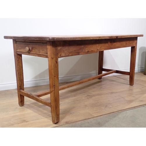 590 - A 19th Century pine Farmhouse Table fitted end drawer with four plank top mounted upon square cut su... 