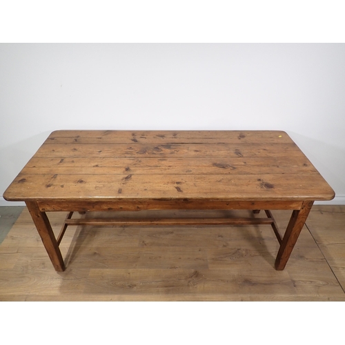 590 - A 19th Century pine Farmhouse Table fitted end drawer with four plank top mounted upon square cut su... 