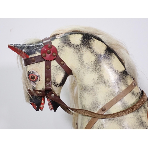 609 - An antique dapple grey carved and painted wooden Rocking Horse 3ft 10in L x 3ft 3in H