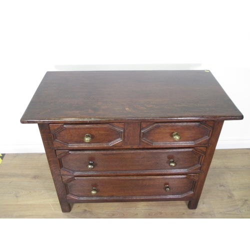 61 - A moulded oak Chest of two short and two long drawers 3ft 3in W x 2ft 6in H