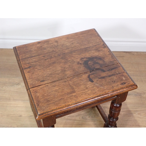 612A - An antique oak square Joint Stool in the 17th Century style mounted upon turned supports united by s... 