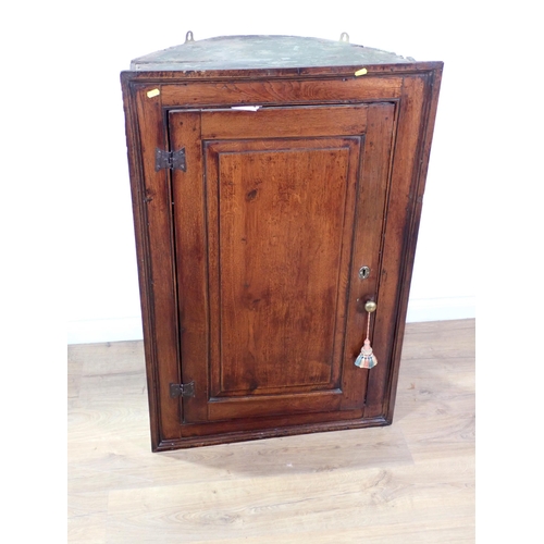 616 - A late 18th Century oak hanging Corner Cupboard fitted single fielded panel door 3ft 6in H x 2ft 4in... 