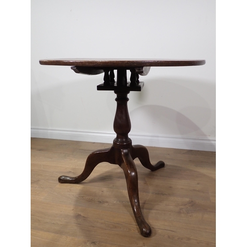 636 - An 18th Century oak Pillar Table with birdcage action on baluster turned column and tripod base 2ft ... 