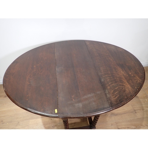 638 - An oak dropleaf Table on barley twist supports 3ft 1in W x 2ft 5in H