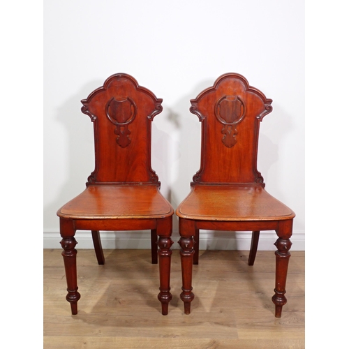 643 - A pair of Victorian mahogany Hall Chairs