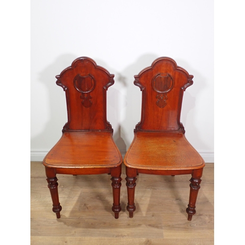 643 - A pair of Victorian mahogany Hall Chairs