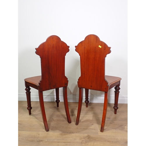 643 - A pair of Victorian mahogany Hall Chairs