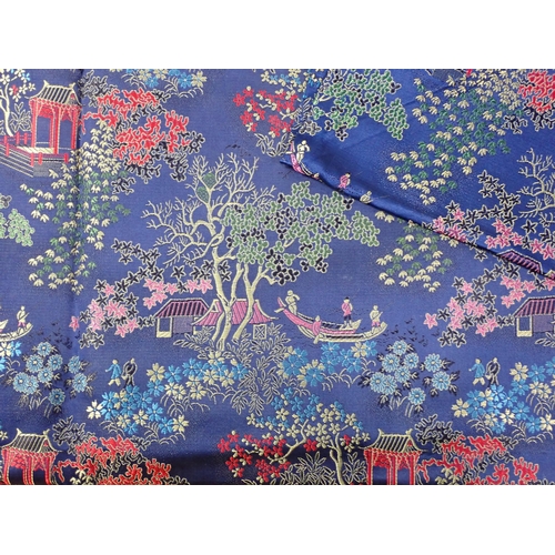 656 - A pair of Japanese silk deep blue Bed Covers with scenes of Pagodas within blossom filled trees 7ft ... 