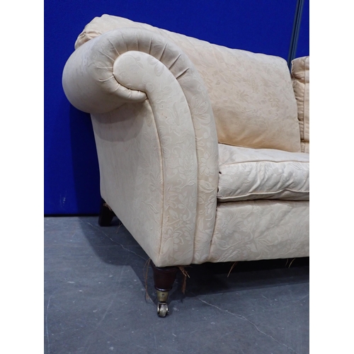 658 - A gold upholstered three seater Sofa on turned mahogany supports 7ft 3in W x 2ft 6in H