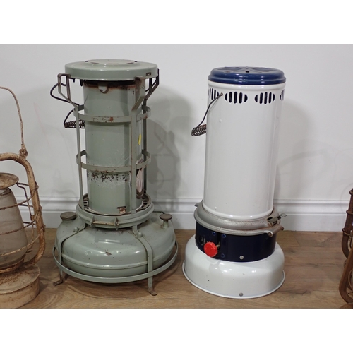 667 - Two paraffin Greenhouse Heaters and four Tilly Lamps