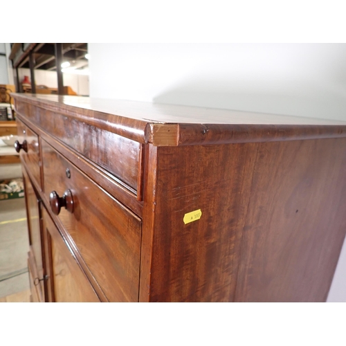 670 - A 19th Century mahogany Linen Press Cupboard with two small drawers above a pair of cupboard doors e... 