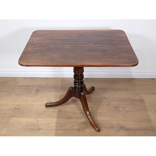 672 - A 19th Century mahogany tilt-top Table with rounded rectangular top on turned column and tripod base... 