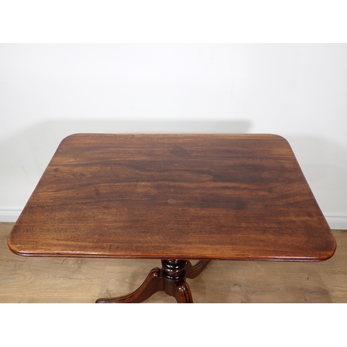 672 - A 19th Century mahogany tilt-top Table with rounded rectangular top on turned column and tripod base... 