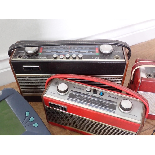 679 - A BT Telephone, and four Roberts Radios