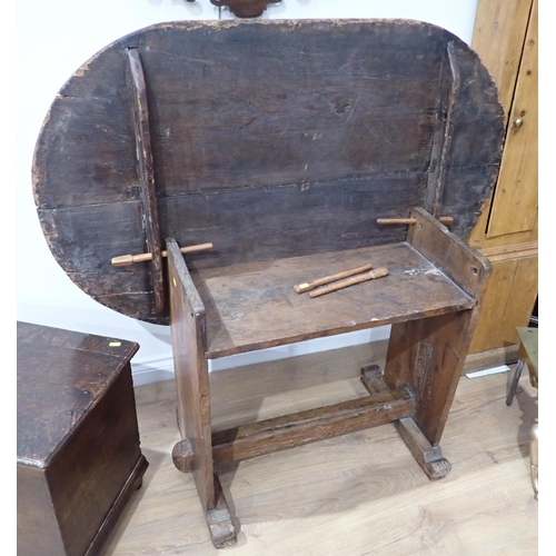 694 - A 17th Century oak Monks Bench, with adjustable oval top 4ft 4in W x 2ft 6in H