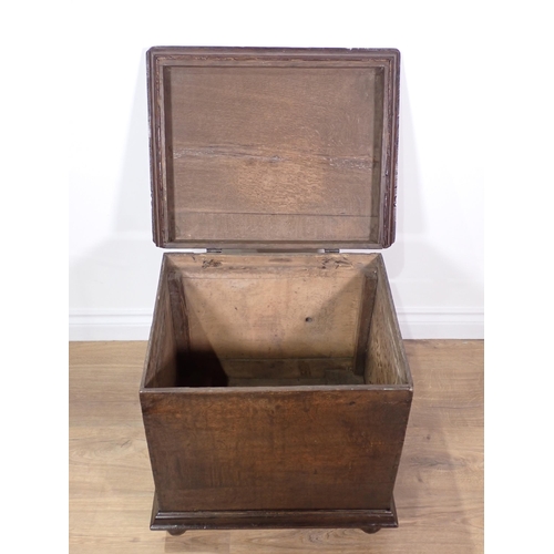 695 - An antique oak Box with moulded hinged lid mounted on bun feet 1ft 9in W x 1ft 8in H