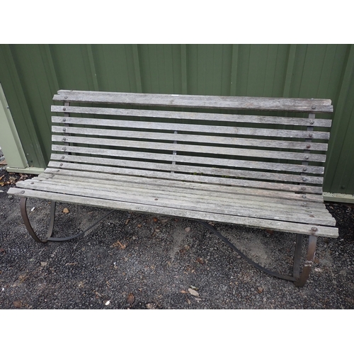 748 - A Garden Bench with wooden slats and iron supports 5ft 11in W