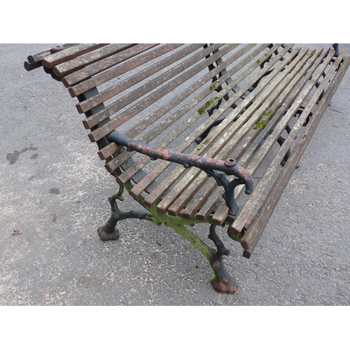 750 - A Coalbrookdale style Bench with cast iron branch effect supports and wooden slats 6ft 7in W