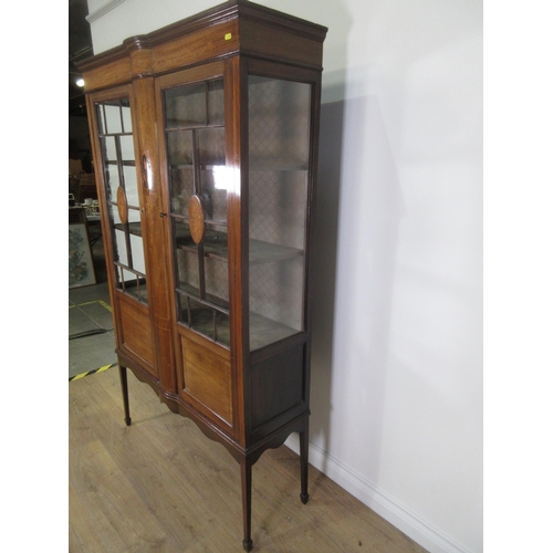 8 - An Edwardian mahogany and inlaid Display Cabinet fitted pair of doors mounted upon square cut taperi... 