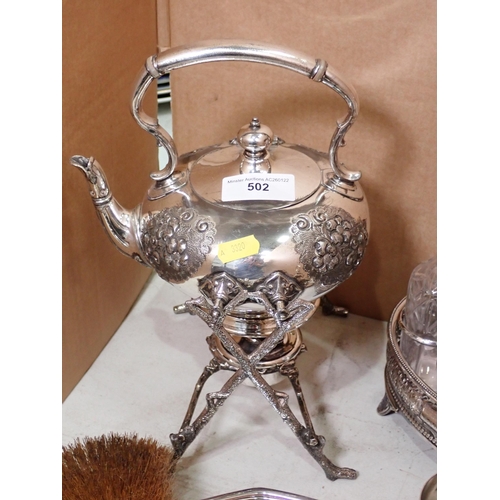 502 - An engine turned silver Dressing Table Set, a plated Condiment Set on stand, an embossed Tray, a pla... 