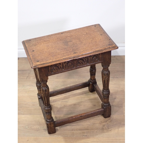 53 - An oak Joint Stool in the 17th Century style mounted on reeded supports 1ft 11in H x 1ft 8in W