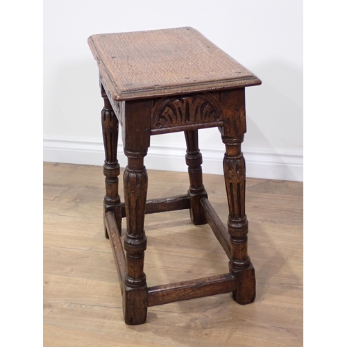 53 - An oak Joint Stool in the 17th Century style mounted on reeded supports 1ft 11in H x 1ft 8in W