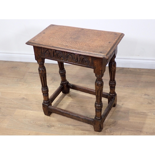 53 - An oak Joint Stool in the 17th Century style mounted on reeded supports 1ft 11in H x 1ft 8in W