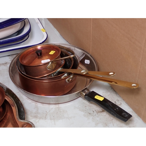 550 - A set of enamel Roasting Dishes and Bowls, a set of graduated copper Pans, Frying Pan and a Riding H... 