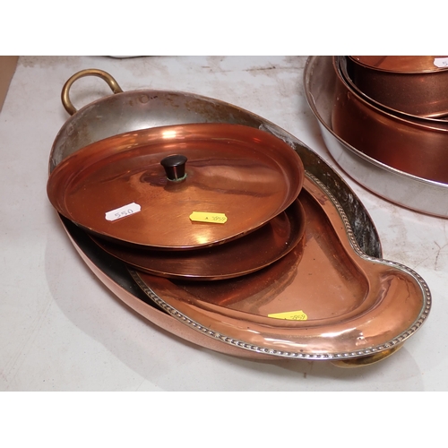 550 - A set of enamel Roasting Dishes and Bowls, a set of graduated copper Pans, Frying Pan and a Riding H... 