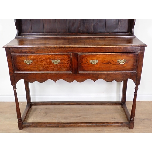 559 - An oak Dresser and Rack in the 18th Century style fitted two drawers above shaped frieze 6ft 2in H x... 