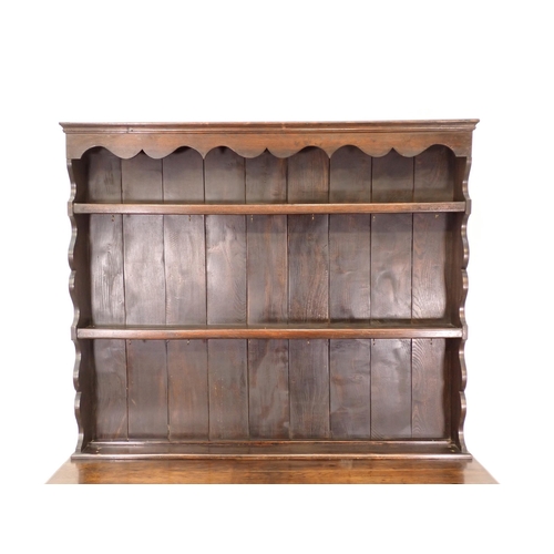 559 - An oak Dresser and Rack in the 18th Century style fitted two drawers above shaped frieze 6ft 2in H x... 