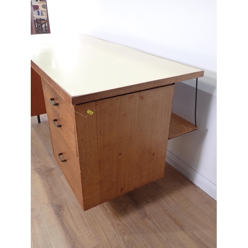 562 - A 20th Century hardwood Desk fitted seven drawers in the manner of Robin Day, 5ft 1in W x 2ft 5in H