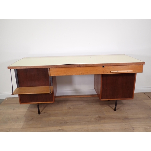 562 - A 20th Century hardwood Desk fitted seven drawers in the manner of Robin Day, 5ft 1in W x 2ft 5in H