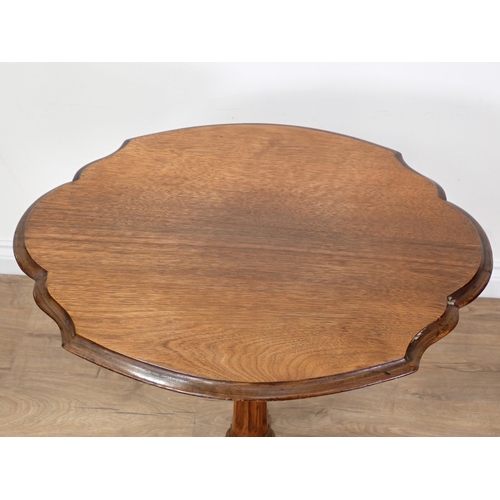 576 - A Victorian walnut Pillar Table with shaped top on quadruple base 2ft 5in H x 1ft 11in W