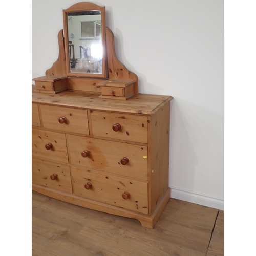 578 - A modern pine Dressing Chest fitted seven drawers on shaped base 5ft 2in H x 4ft 8in W