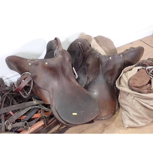 586 - Three leather Saddles, bag of Bits and Bridles, etc.