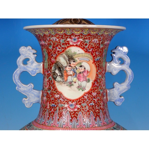 599 - A Chinese two handled Vase converted to a Table Lamp with reserves of figures 14in H (excluding ligh... 