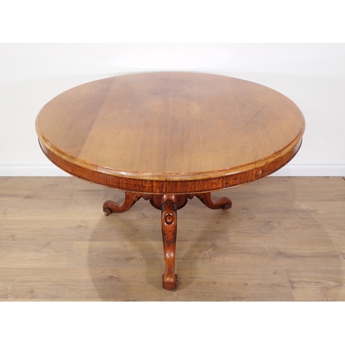 606 - A Victorian circular walnut Breakfast Table on carved tripod base 3ft 10in D x 2ft 4in H