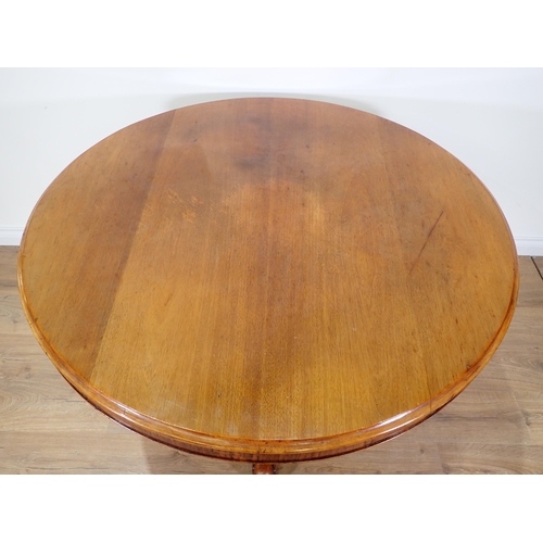 606 - A Victorian circular walnut Breakfast Table on carved tripod base 3ft 10in D x 2ft 4in H