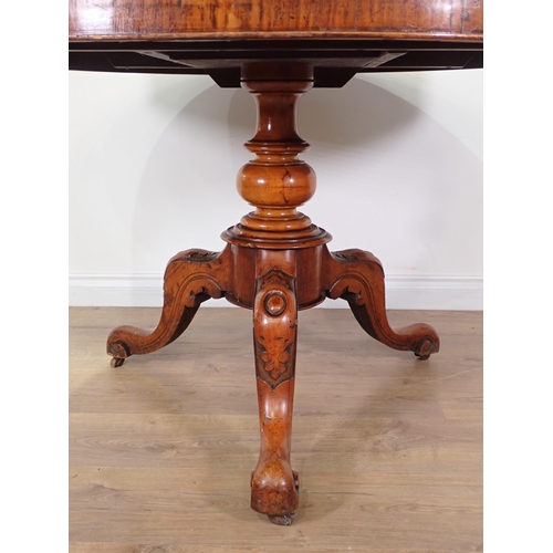 606 - A Victorian circular walnut Breakfast Table on carved tripod base 3ft 10in D x 2ft 4in H