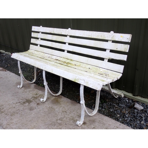 755 - A white painted wooden and wrought iron Garden Bench