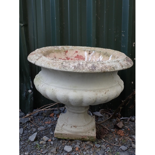 764 - Four concrete fluted pedestal Urns