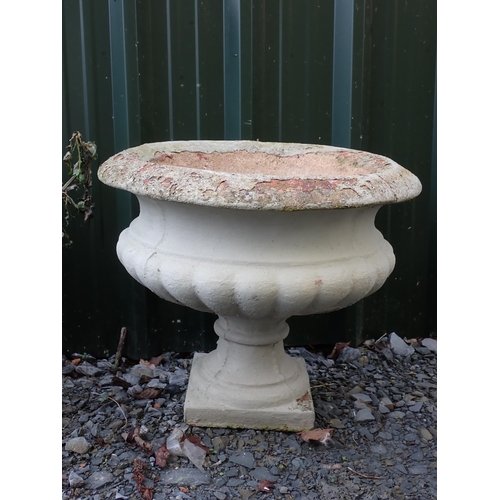 764 - Four concrete fluted pedestal Urns