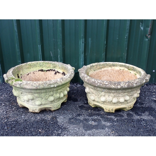 771 - A pair of composite circular Planters