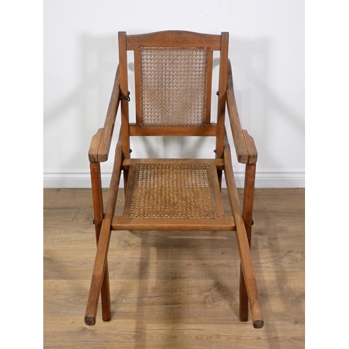 93 - A mahogany framed Sedan Chair with cane infilled panels by Philip Hams & Co, Birmingham 1913 3ft 11i... 