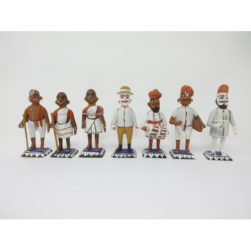 97 - A collection of approx 30 Indian wooden and painted Figures including Snake Charmer, etc, approx 3in