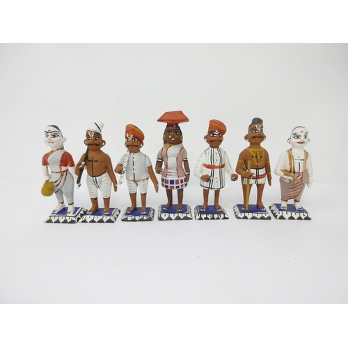 97 - A collection of approx 30 Indian wooden and painted Figures including Snake Charmer, etc, approx 3in